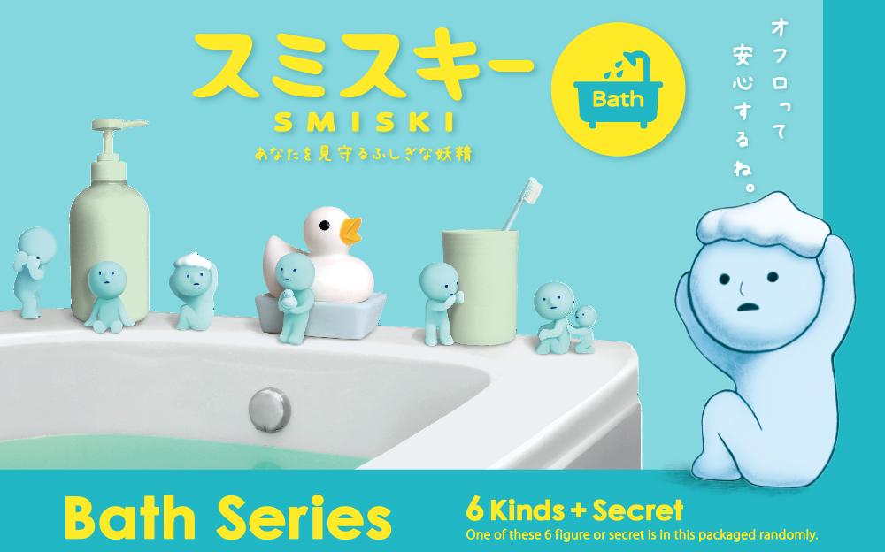 A promotional image featuring a blue creature, Smiski, in a bathroom setting with various bath-related items such as a soap dispenser, toothbrushes, and a bath caddy. The image has Japanese text and is labeled as part of the 'Smiski Bath Series' with a tag indicating 6 kinds plus a secret.